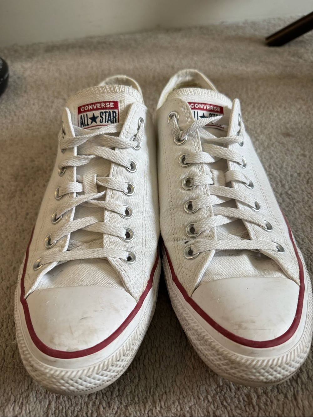 Converse Low Top Sneakers in White with Red Trim